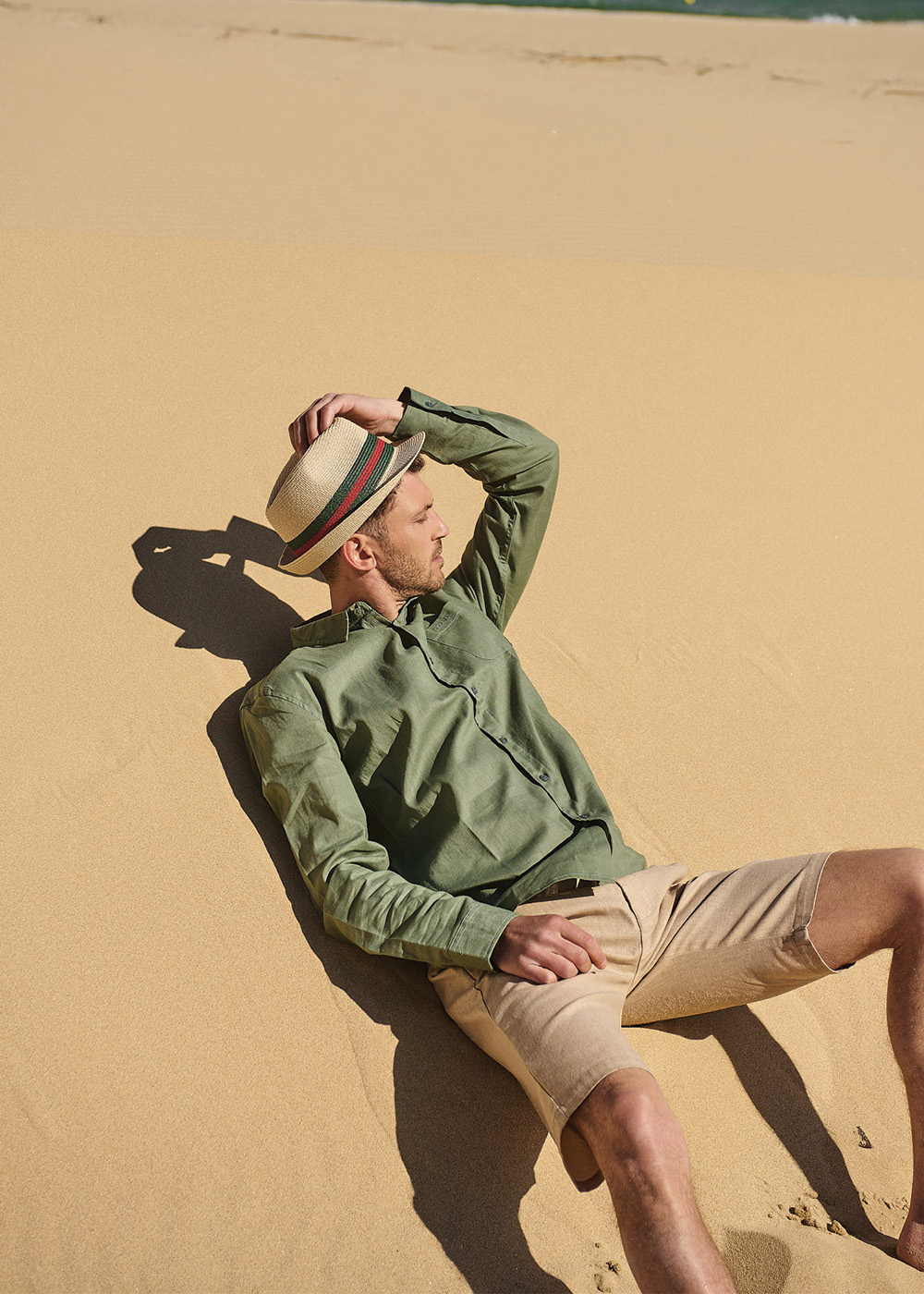 Beige fedora with green & red details